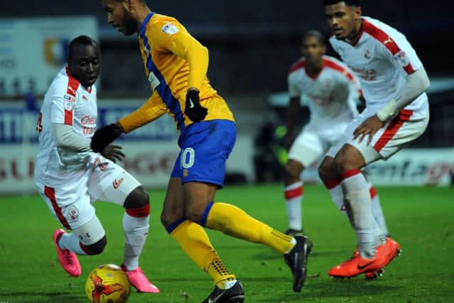 Mansfield Town v Crawley Town action from last season when Dermott Drummy took on Steve Evans at the One Call Stadium.