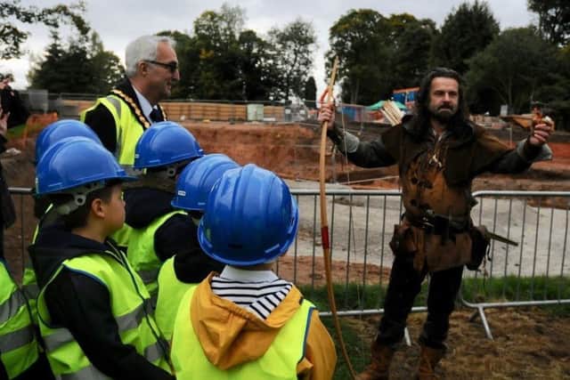 Robin Hood himself on site with children from St Mary's Church Of England Primary School, Edwinstowe, who have planted a tree there, and Coun John Handley, chairman of Nottinghamshire County Council.