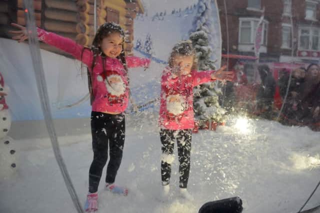 Sutton In Ashfield Christmas lights switch on, snow globe fun for Lillie-Mae Bowner, six and Matilda Bowell, three