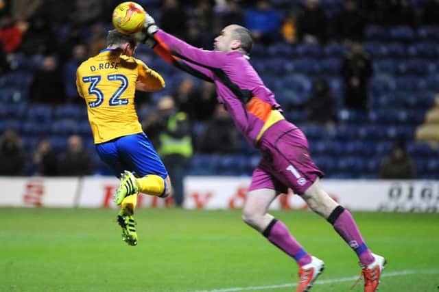 Mansfield Town v MorcombeDanny Rose has the ball pinched off his head by Morcambe 'keeper Barry Roche.