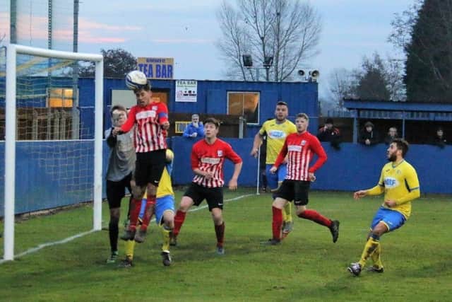 A headed clearance by a Teversal defender during their win at Gedling. (PHOTO BY: Tony Hay)