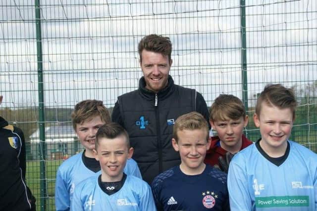 Adam with five of his young goalkeepers at AC1.