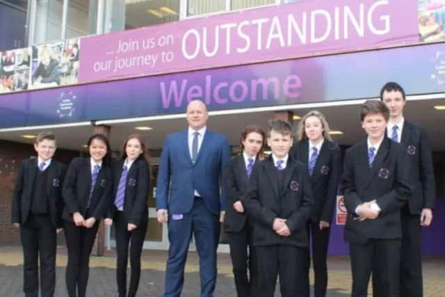 Principal Tim Croft with pupils at Sutton Community Academy.