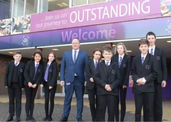Principal Tim Croft with pupils at Sutton Community Academy.