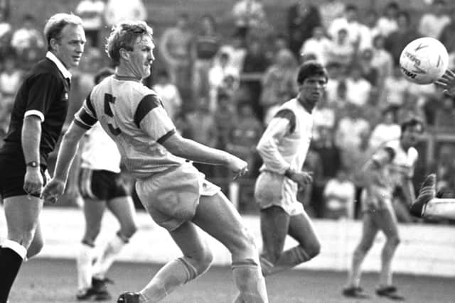 George Foster defending for the Stags