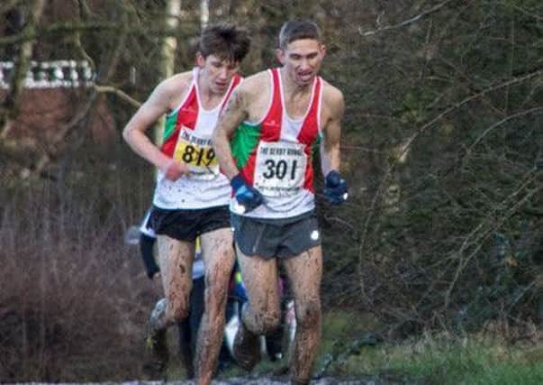 Action from the cross-country county championships as two runners from Sutton Harriers plough through the mud. (PHOTO BY: Craig Linacre)