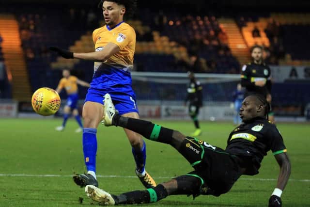Lee Angol challenges for the ball against Yeovil. Photo by Chris Etchells.