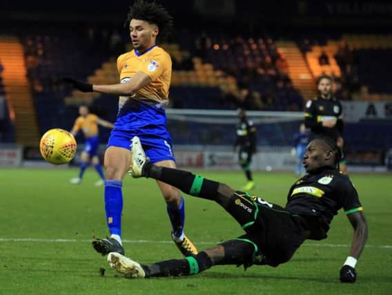 Lee Angol challenges for the ball against Yeovil. Photo by Chris Etchells.