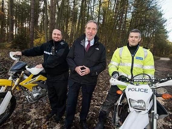 From left are Sgt Carl Holland, Nottinghamshire PCC Paddy Tipping and Sgt Simon Whitehouse
