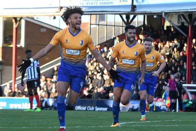 Lee Angol celebrates his equaliser. Pic by
Andrew Roe.