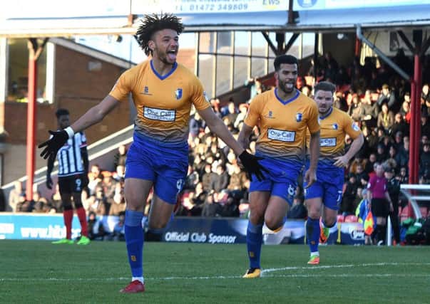 Lee Angol celebrates his equaliser. Pic by

Andrew Roe.