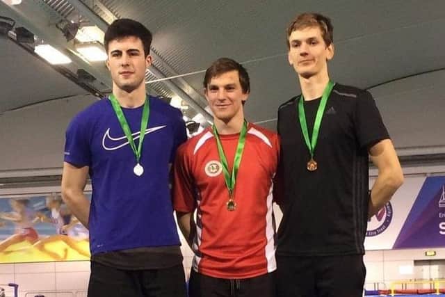 Jordan Mitchell on the podium after his gold-medal success in the Midland Championships.
