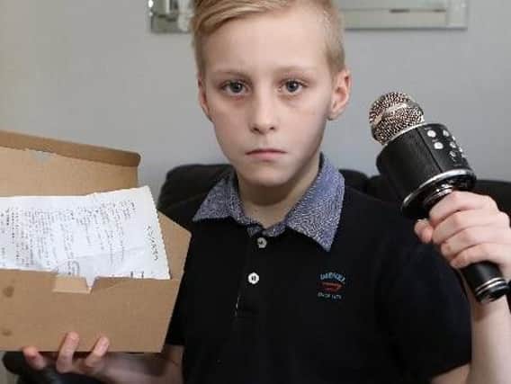 Shawn Harris, 9, and his faulty microphone.