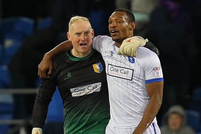 Picture by Gareth Williams/AHPIX.com; Football; The Emirates FA Cup; Cardiff City v Mansfield Town; 6/1/18  KO 15.00; Cardif City Stadium; copyright picture; Howard Roe/AHPIX.com; Mansfield skipper Krystian Pearce celebrates with goalkeeper Conrad Logan who was their injury-time hero with a fantastic save to ensure a replay
