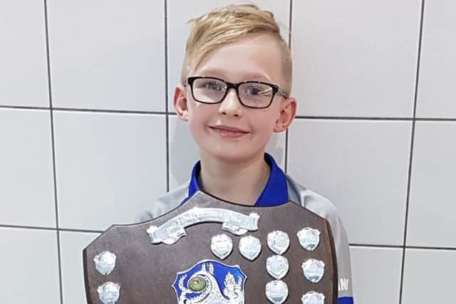 Stanley Milasinovich with the relay gala shield won by Sutton Swimming Club.