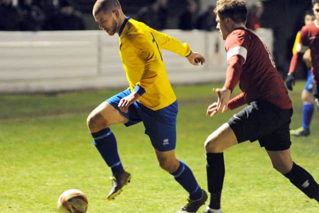 AFC Mansfield's Craig Mitchell (yellow shirt)