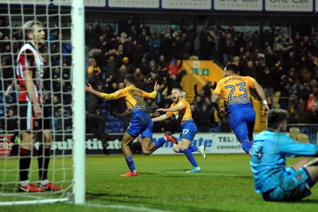 Mansfield Town v Cheltenham Town.CJ Hamilton turns to take the applause after his extra time match winning goal at The One Call Stadium on Saturday.