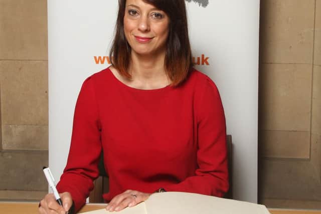 MP Gloria De Piero signs the Holocaust Book Of Commitment.