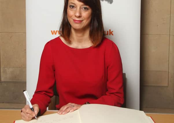 MP Gloria De Piero signs the Holocaust Book Of Commitment.