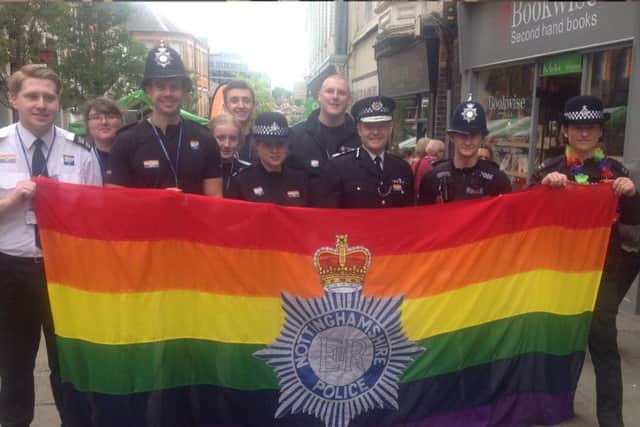 Police officers, including Chief Constable Craig Guildford, with staff and volunteers, flying the flag at the Nottinghamshire Pride event of 2017.