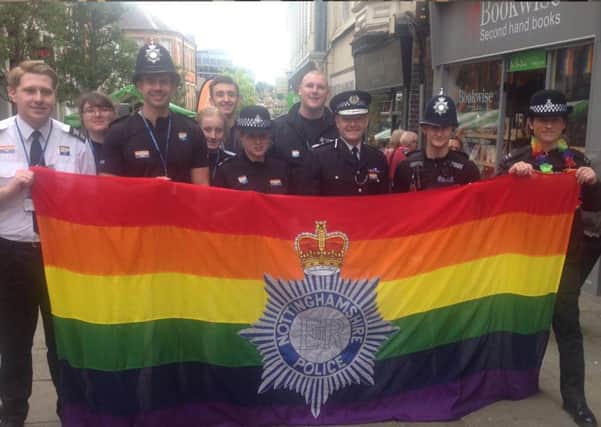 Police officers, including Chief Constable Craig Guildford, with staff and volunteers, flying the flag at the Nottinghamshire Pride event of 2017.
