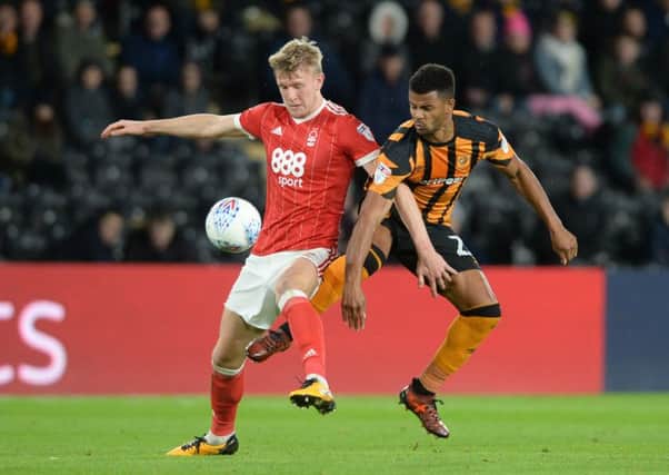 Fraizer Campbell and Joe Worrall challenge for the ball.
Hull City v Nottingham Forest.  SkyBet Championship.  KCOM Stadium.
28 October 2017.  Picture Bruce Rollinson