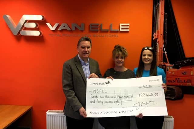 Van Elle boss Jon Fenton hands over a cheque to the NSPCCs community fundraising manager Claire Campbell and Childline volunteer Kate Frisby.