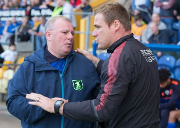 Mansfield Town vs Swindon Town -  Mansfield Town manager Steve Evans and Swindon Town manager David Flitcroft- Pic By James Williamson