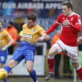 Picture by Gareth Williams/AHPIX.com; Football; Sky Bet League Two; Swindon Town v Mansfield Town; 10/2/18  KO 15.00; The Energy Check County Ground; copyright picture; Howard Roe/AHPIX.com; Mansfield's Alex MacDonald plays the ball away from Swindon's Timi Elsnik