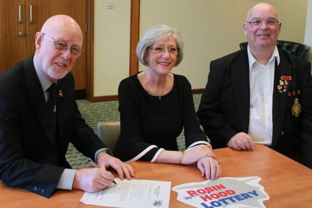 Rick Richardson (left), the Royal British Legion president for the Mansfield district, with Executive Mayor Kate Allsop and the Legion's Poppy Appeal organiser for the Mansfield branch, Mick Beresford.