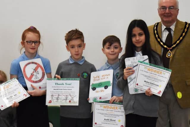 Pictured are Ashfield District Council Officer, Gill Brooks, Daisy Theaker,  Austin Wood, Maisa Karimzada and Vice Chairman of Ashfield District Council, Coun Mike Smith with the Litter Poster Awards.