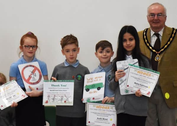 Pictured are Ashfield District Council Officer, Gill Brooks, Daisy Theaker,  Austin Wood, Maisa Karimzada and Vice Chairman of Ashfield District Council, Coun Mike Smith with the Litter Poster Awards.