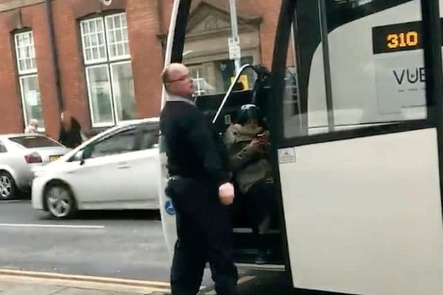 The driver was filmed trying to drag the woman off the coach by her legs.