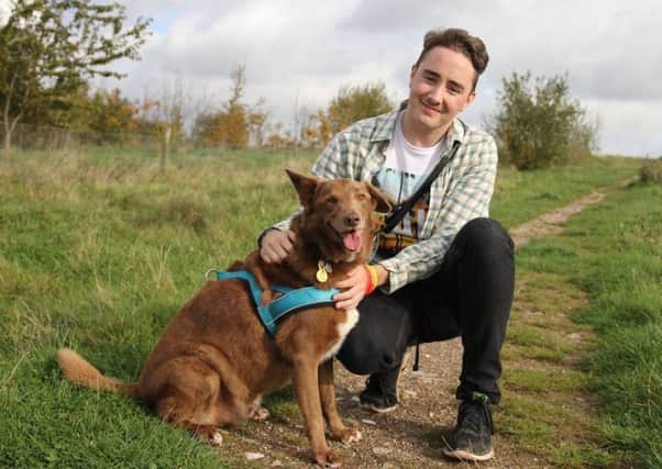 Mansfield man Robin Jones, who has Asperger Syndrome, with his faithful and reliable friend, pet dog, Charlie.
