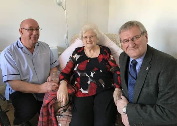 Jean Cox with Coun Stuart Wallace (right) and support worker Trevor Warren, of Nottinghamshire County Council.