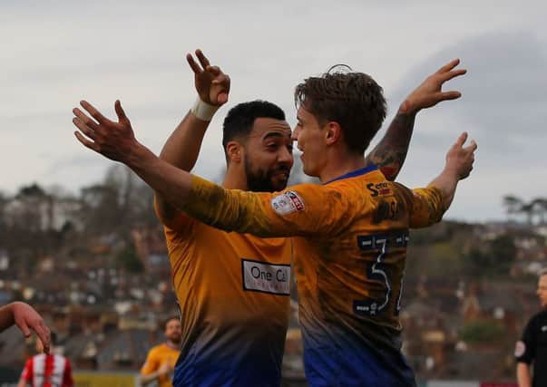Kane Hemmings helps celebrate Danny Rose's goal at Exeter.
