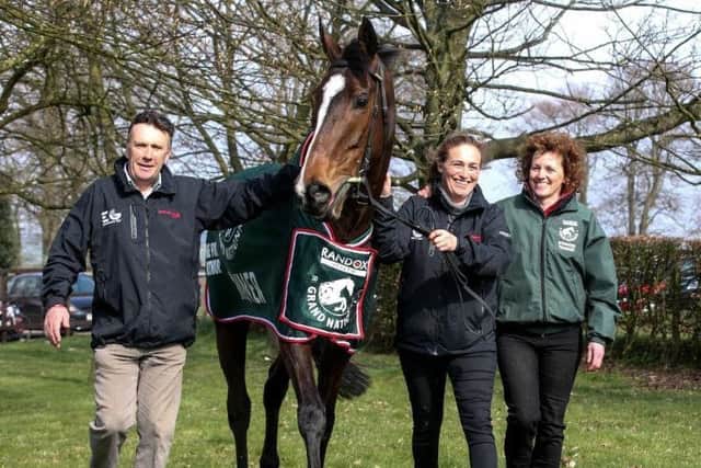 One For Arthur back home after his Grand National triumph at Aintree last year. He is flanked by trainer Lucinda Russell, her partner, former champion jockey Peter Scudamore, and groom Jaimie Duff.