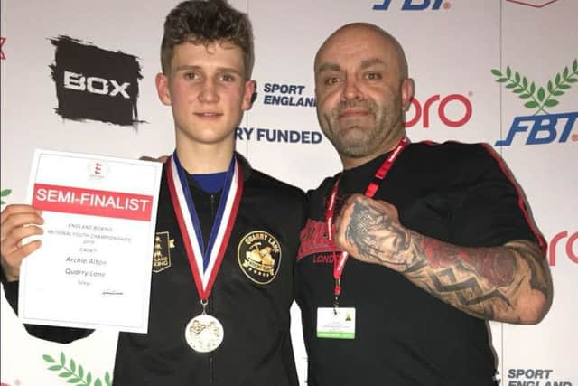 Archie Alton (left), with head coach Julian Leivars, after he had reached the semi-finals of the National Youth Cadet Championships.