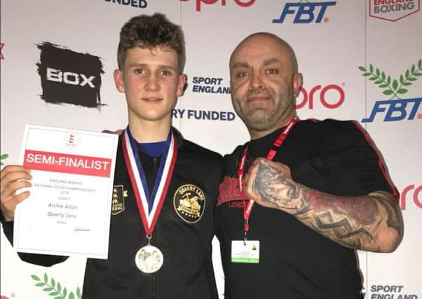 Archie Alton (left), with head coach Julian Leivars, after he had reached the semi-finals of the National Youth Cadet Championships.