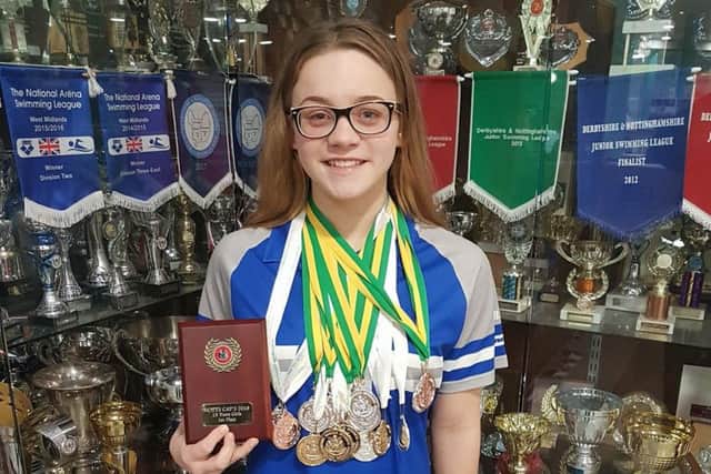 Chloe Quinn with her medals and trophies.