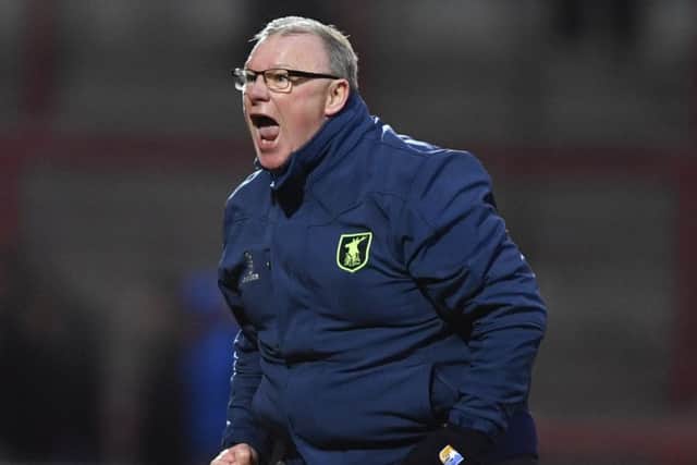 Mansfield Town manager Steve Evans celebrates victory: against Morecambe. Picture by Steve Flynn/AHPIX.com.