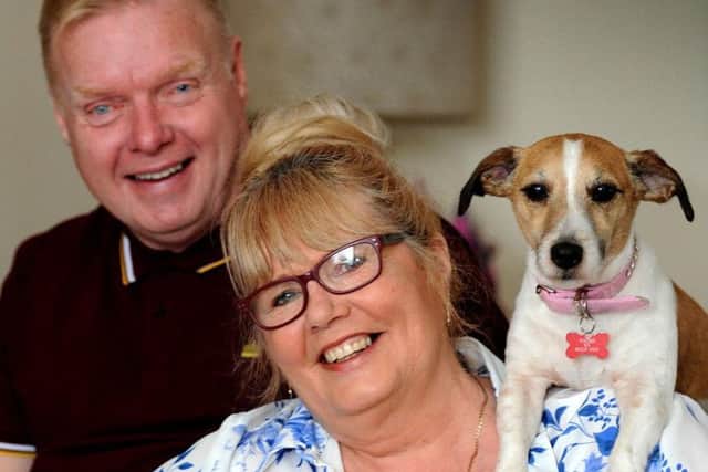 Angela Yates of Clipstone who is on an ITV singing show, with husband Mick and dogs Hollie and Casper.