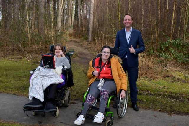 Portland College unveils plans for an accessible Woodland Activity Trail, pictured is Edward Johnstone with students Shannan and Sophie