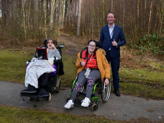 Portland College unveils plans for an accessible Woodland Activity Trail, pictured is Edward Johnstone with students Shannan and Sophie