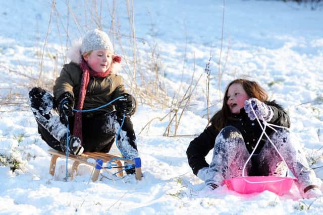 Sledging on the Millenium Green gets the approval of Mansfield Woodhouse youngsters on Wednesday.