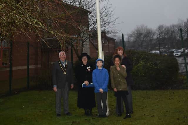 Pictured are leader of Ashfield District Council, Cheryl Butler, vice chairman, Mike Smith, Deputy Lord Lieutenant Sue Gorham and pupils from Orchard Primary School.