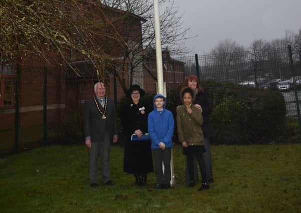 Pictured are leader of Ashfield District Council, Cheryl Butler, vice chairman, Mike Smith, Deputy Lord Lieutenant Sue Gorham and pupils from Orchard Primary School.