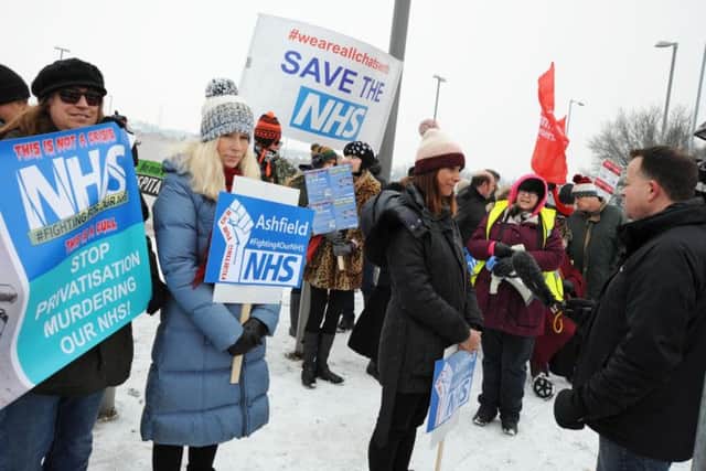 Over 30 protesters braved the snowy weather on Saturday, March 5.
