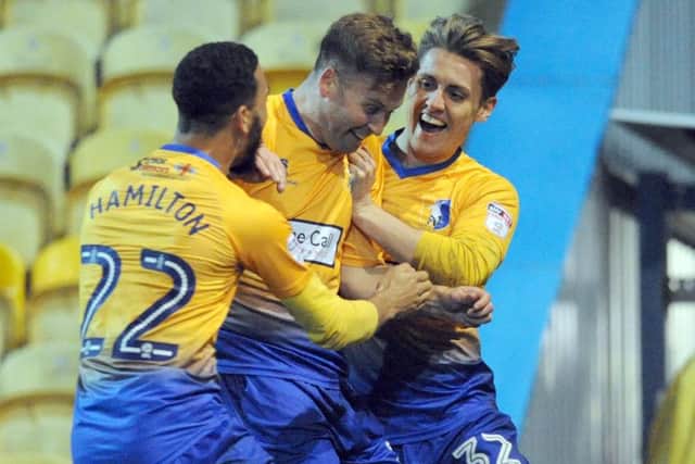 Mansfield Town v Lincoln City
Joel Byrom celebrates his second half goal with CJ Hamilton and Danny Rose.