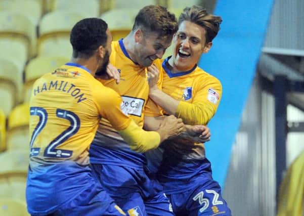 Mansfield Town v Lincoln City
Joel Byrom celebrates his second half goal with CJ Hamilton and Danny Rose.
